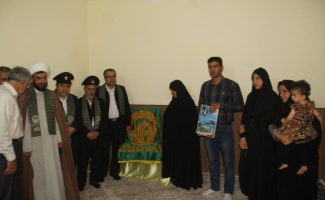 دیدار خادمان بارگاه رضوی با خانواده های شهدای شهرستان سرپل ذهاب