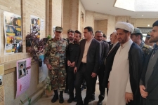 نمایشگاه عکس و پوستر به مناسبت گرامیداشت نهم دی ماه در حرم مطهر احمد بن اسحاق(ره) شهرستان سرپل ذهاب برگزار شد