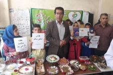 برگزاری "جشنواره غذای سالم " دانش آموزان سرپلذهابی درهفته سلامت