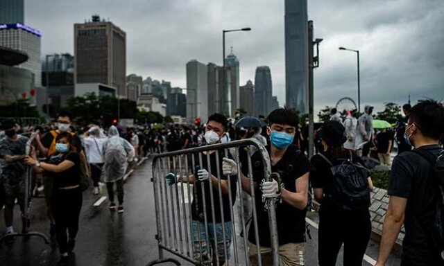 راهپیمایی گسترده در هنگ کنگ این دولت شهر را فلج کرد